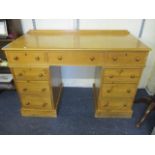 A pine twin pedestal desk 31" x 47" x 21"