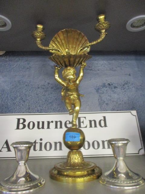 A pair of Gorham American sterling silver candlesticks and a brass candelabra with twin sconces,