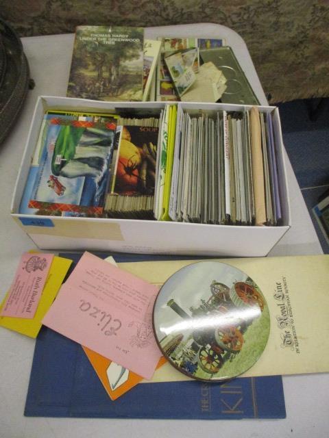 A mixed lot to include postcards, cigarette cards, books and other mixed ephemera
