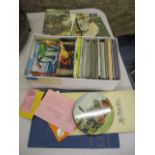 A mixed lot to include postcards, cigarette cards, books and other mixed ephemera