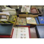 First Day Covers, loose stamps, loose album pages, stamps on a card, a quantity of mint GB