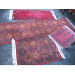 Four mixed rugs to include a Shiraz hand knotted runner