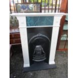 A Victorian fireplace fitted into a later white painted surround 43 1/2"h x 35 1/2"w