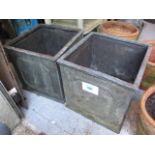 A pair of fibreglass garden planters 18"h x 17 1/2"w