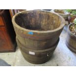 A pair of teak and metal support large garden planters