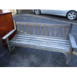 A teak garden bench 33"h x 62 1/2"w