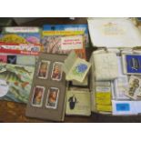 A selection of loose cigarette cards, albums and silks