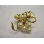 A 14ct gold and pearl brooch