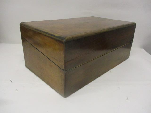 A Victorian figured walnut, military style writing slope with brass edges, enclosing a pair of - Image 4 of 6