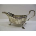 A 1930s silver sauce bowl by William Hutton & Son, Birmingham 1938 with a gadrooned border and