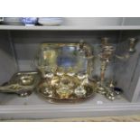 A selection of silver plate to include an oval plated on copper galleried tray, cruet sets, and a