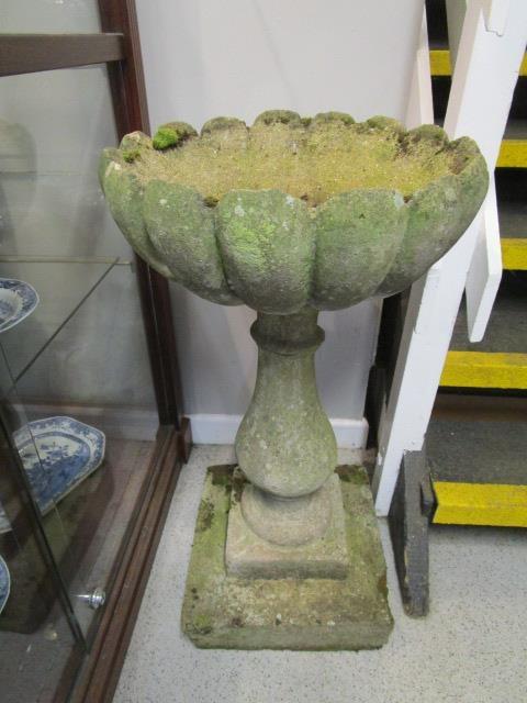 Weathered composition bird bath, on baluster base