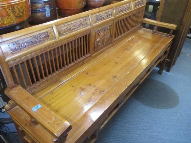 An oak Chinese bench with carved panels 36" x 67" x 19"