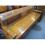An oak Chinese bench with carved panels 36" x 67" x 19"