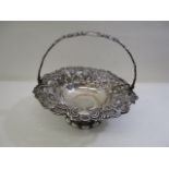 A Victorian silver basket by Henry Wilkinson & Co, Sheffield 1943, with a cast handle and embossed