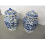 A pair of blue and white 19th century Chinese jars and covers