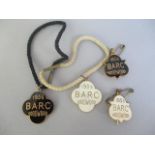 Two pairs of BARC Goodwood enamelled members badges both with cords and two guest badges, each