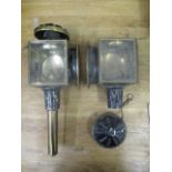 A pair of 19th century black painted metal and brass carriage lamps, the crown with a ring handle, a