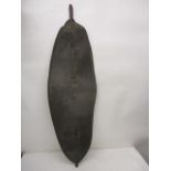 An 'Antique' African oval leather shield with a central panel of crocodile/alligator spikes and a