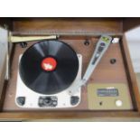 A 1930s walnut cased gramophone cabinet with a hinged top enclosing a Garrard model 301 record