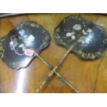 A pair of Victorian lacquered fans with gilt and mother of pearl detail