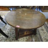 A 19th century circular mahogany topped, two tier cricket table, 22"h x 29" w