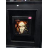 STS '94 - Shattered Face, a model of a broken face set in acrylic, mounted against a black velvet