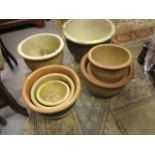 Two sets of three graduated garden planters and two others