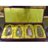 A boxed set of four reproduction Chinese scent bottles