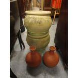 A pair of weathered terracotta garden planters, 12" h and a pair of terracotta vases