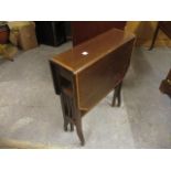 An Edwardian inlaid mahogany Sutherland table, on square legs