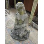 A garden stoneware statue