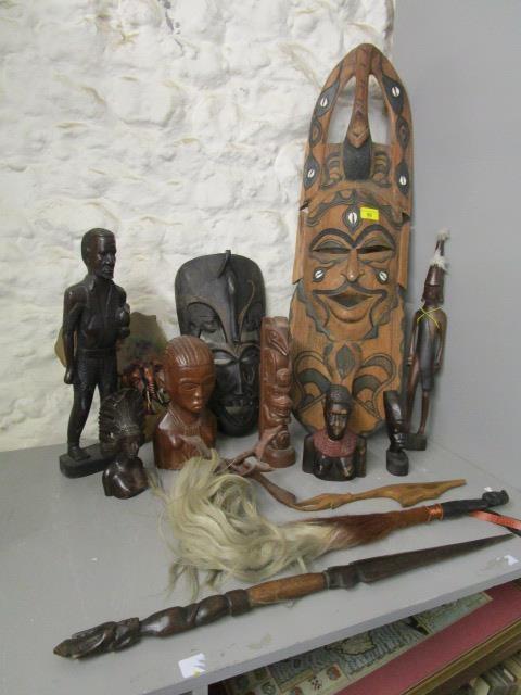 A quantity of African and South American carved wooden tribal art and other items