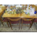 A mid 20th century retro G-Plan teak dining table with a crossbanded, extending top with stowaway