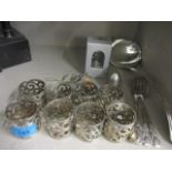 A set of eight silver plated, pierced napkin rings, a set of six silver plated cake forks and