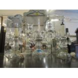 A late Victorian/Edwardian cut glass table candelabra and table lamp matched set, the candelabra