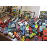 A large mixed lot of toy vehicles to include Corgi McLaren M19A and other items