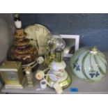 An anniversary clock and three others, together with a retro German pottery lamp and another, as