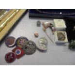 A mixed lot of military badges to include silver standard and a golly badge