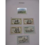 A stamp album containing stamps of Alderney ranging from 1983-2009 in a Stanley Gibbons album