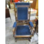 A Victorian American style rocking chair with turned spindle ornament