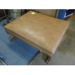 A large brown leather foot stool, 17"h x 40"w