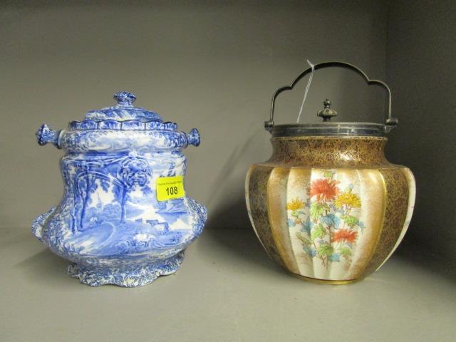 A Doulton Burslem pottery and silver plated biscuit barrel, along with a James Kent blue and white