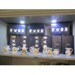 A collection of Royal Worcester Compton & Woodhouse collectors jugs (12), some with boxes