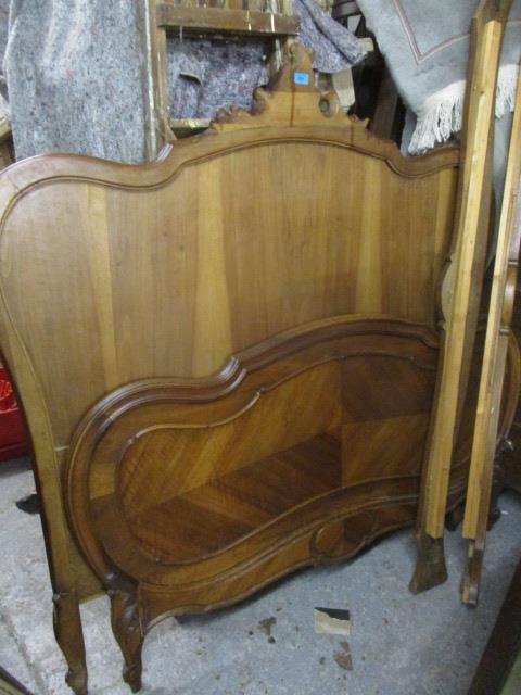 A late 19th century French walnut bedstead, 62 1/2"h x 61"w