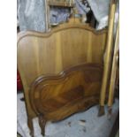 A late 19th century French walnut bedstead, 62 1/2"h x 61"w