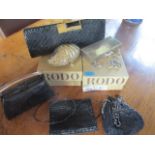 Four Rodo evening bags to include a faux crystal encrusted clam shell clutch and two others