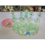 A 1930s uranium green pressed glass dressing table set, a Bagley uranium green glass vase, two pairs