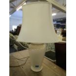 A contemporary cream crackle glazed table lamp with a fabric shade