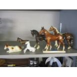 A collection of Beswick and other model of horses
